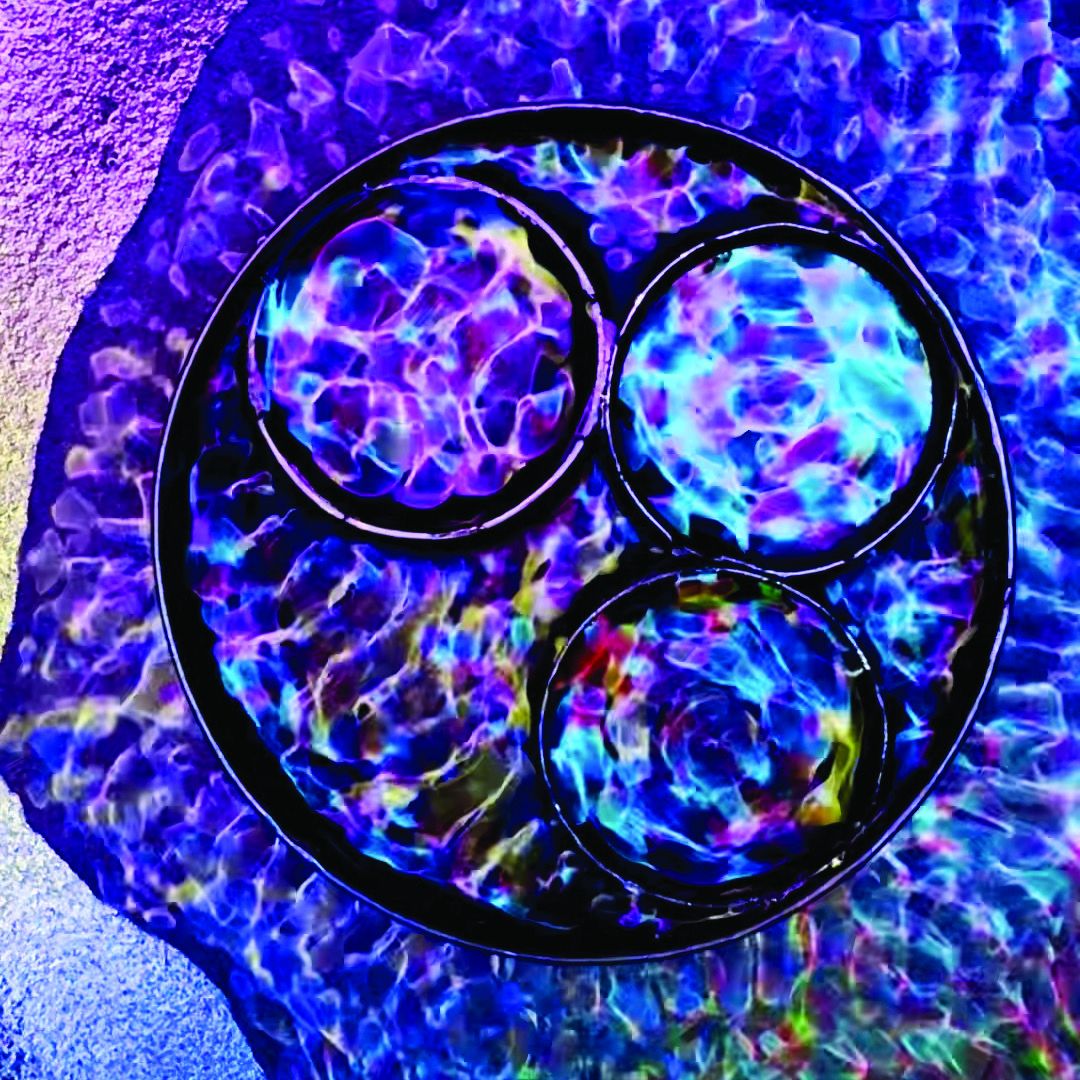 A close-up view of Lyne’s cymatic installation titled 'Water' - a live work created using a subwoofer, water basin, LED lights, and video loop to reveal the unseen patterns of resonance in motion. Photo: Lyne Ismail