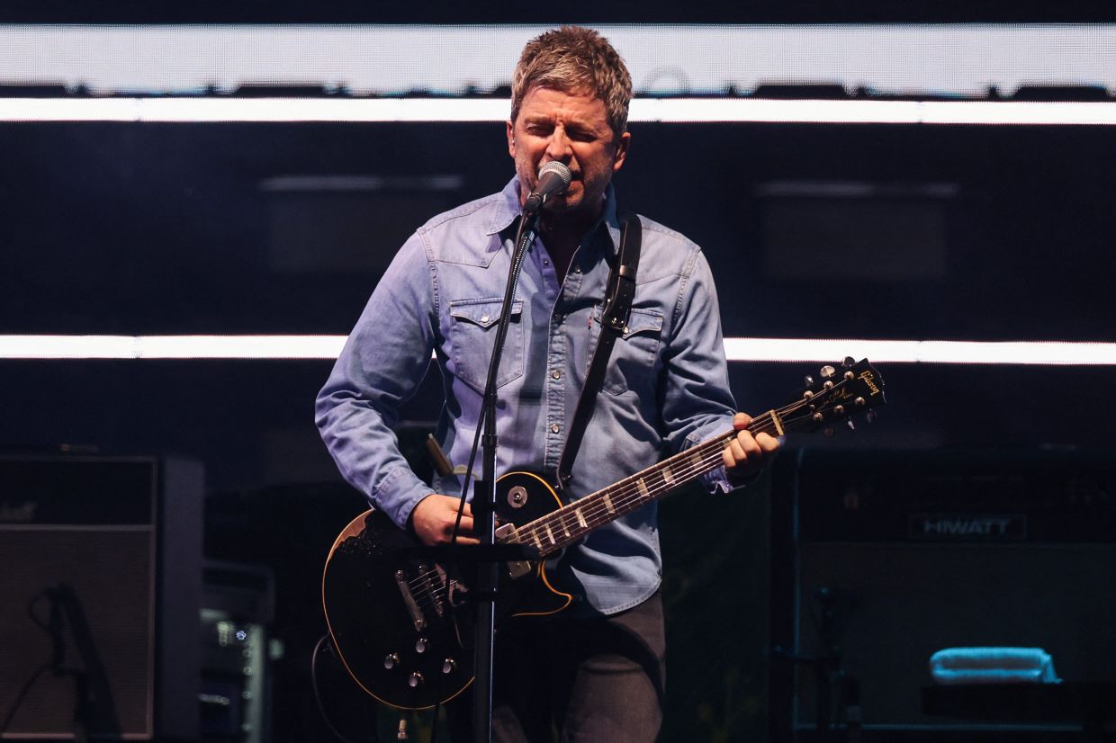 Noel Gallagher of Oasis performs, during the first of their sellout comeback shows, at the Cardiff Principality Stadium, in Cardiff, Wales, Britain, July 4, 2025. REUTERS/Suzanne Plunkett NO RESALES. NO ARCHIVES. NO USE AFTER 365 DAYS AFTER PUBLICATION. PHOTOGRAPHS MAY BE PUBLISHED IN CONTEXT WITH THE SHOW ONLY.