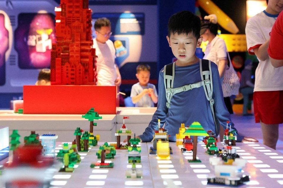 Eager Lego fans rushed into the park as soon as it opened. - Photo: Reuters