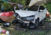 Three injured as car crashes into parked vehicle, coconut stall in Kuala Kangsar
