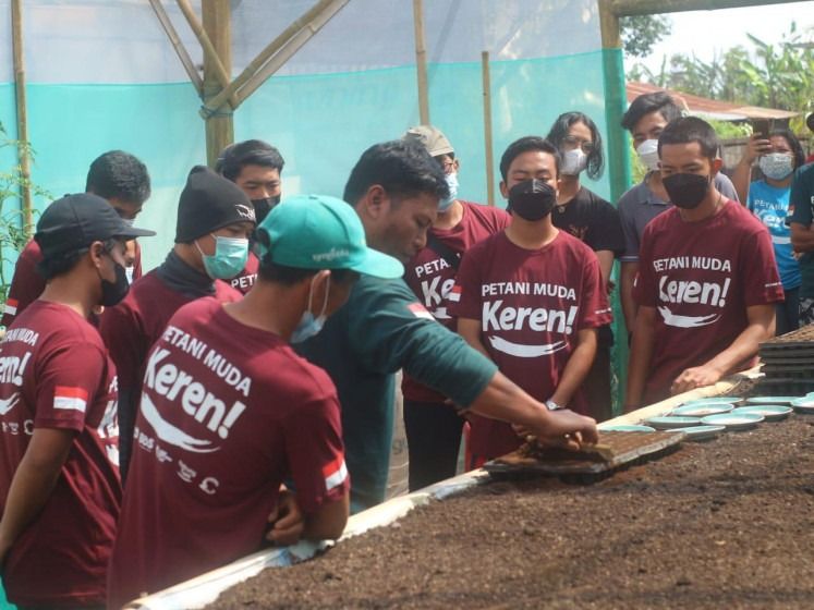 A number of participants engaging in a hands-on agriculture activity facilitated by Cool Young Farmer (Petani Muda Keren) community based in Bali. - Photo: AA Gede Agung Wedhatama