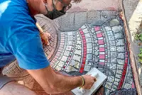Patching pavements, French artist brings flash of colour to Ankara streets