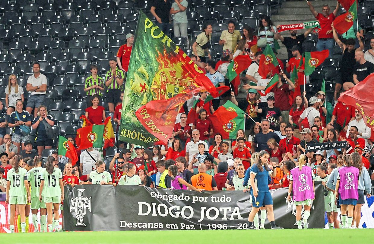 Portugal players and staff display a banner in honour of Jota and his brother Andre Silva after the Women’s Euro 2025 Group B match against Spain at the Stadion Wankdorf in Bern, Switzerland, on July 3. — Reuters