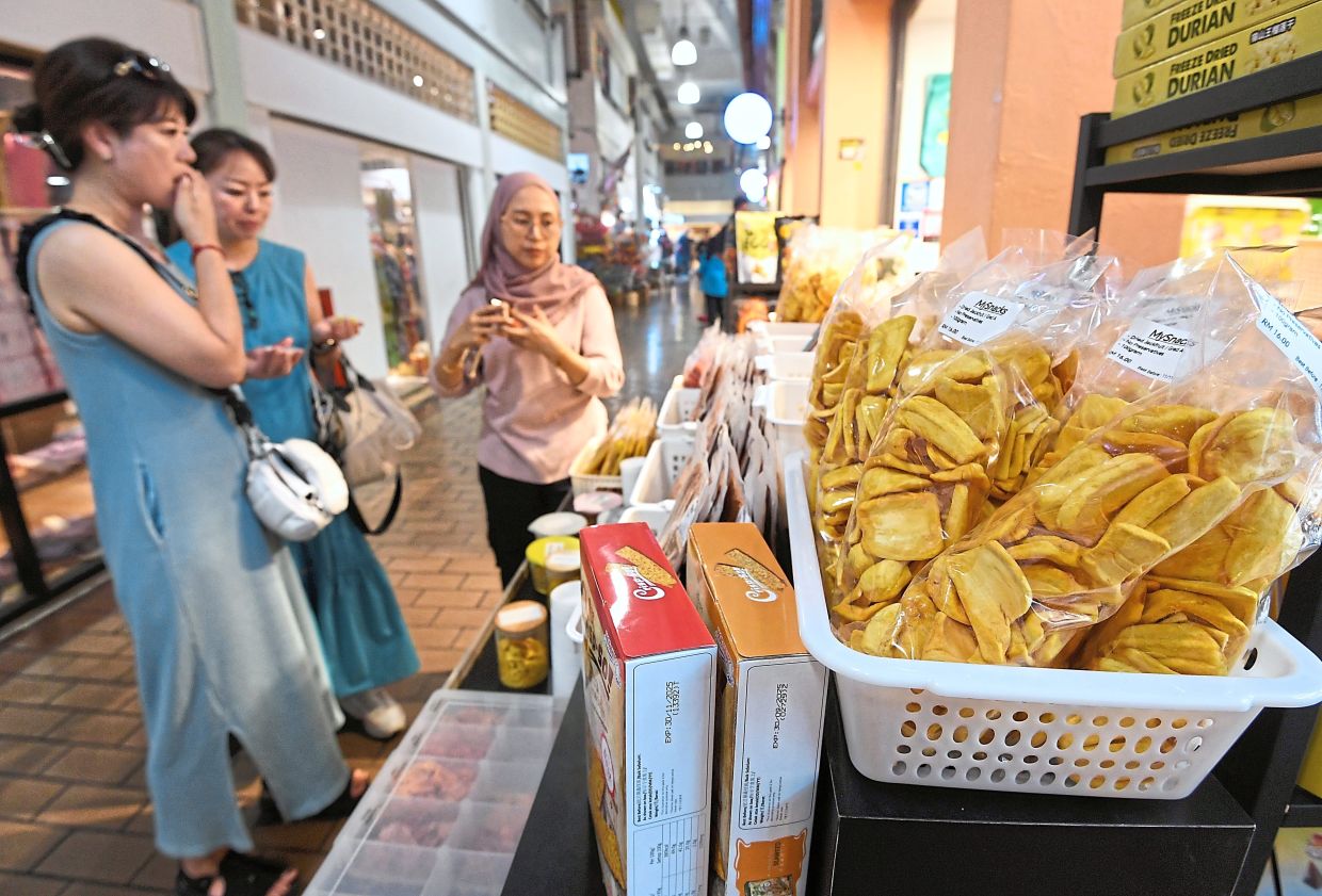 Malaysian snacks tempt visitors at the city centre’s landmark.