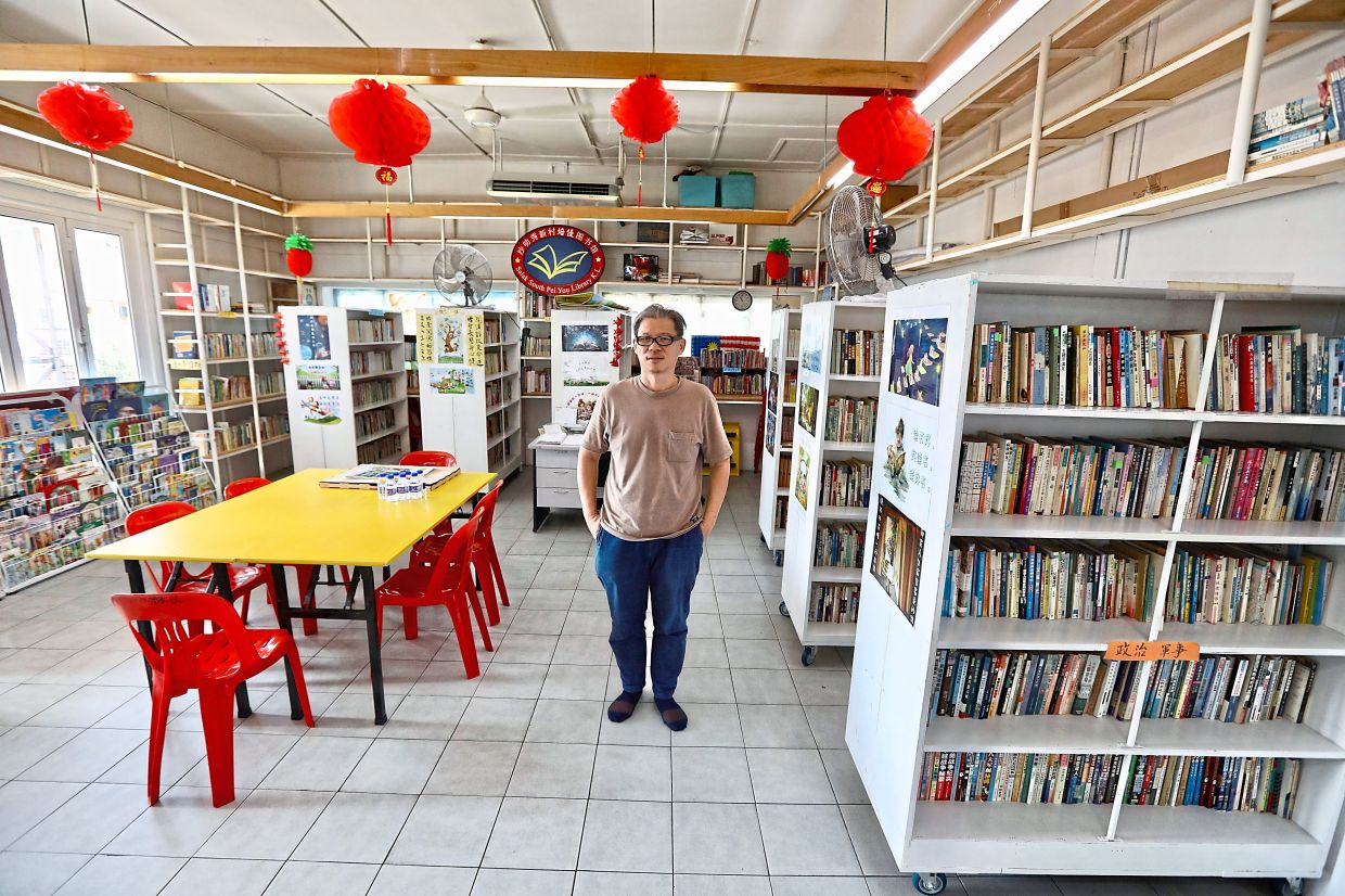 Tey has transformed an old room into a library which now serves as a quiet refuge designed for Salak South New Village folk.