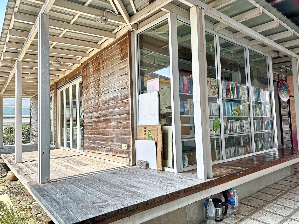 The room, once used as a kitchen for wedding banquets, has been transformed into a community library at Salak South New Village.