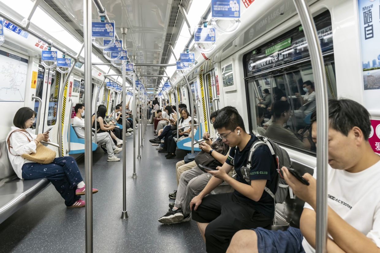 Commuters on one of several subway lines that service Alibaba’s headquarters and other surrounding tech companies, in Hangzhou, China.