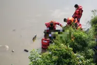 The bodies were found gathered in the back seat, believed to be trying to get out, says firefighters