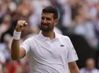 Tennis-Djokovic grinds past De Minaur to reach Wimbledon quarter-finals