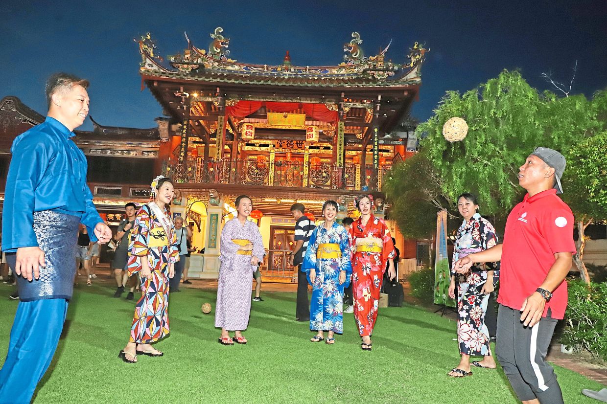 Visitors giving ‘sepak takraw’ a go at Seh Tek Tong Cheah Kongsi. 