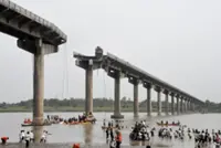At least nine dead after Gujarat bridge collapses, plunging vehicles into river