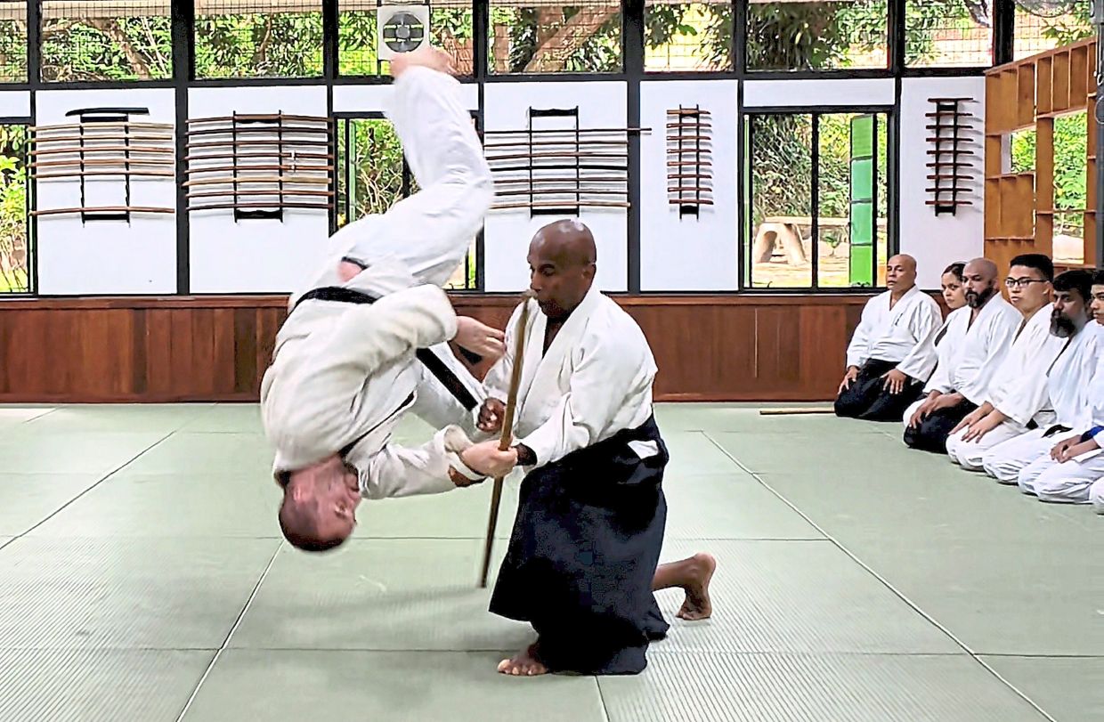 Joe Thambu (right) performing during a demonstration at the open day.