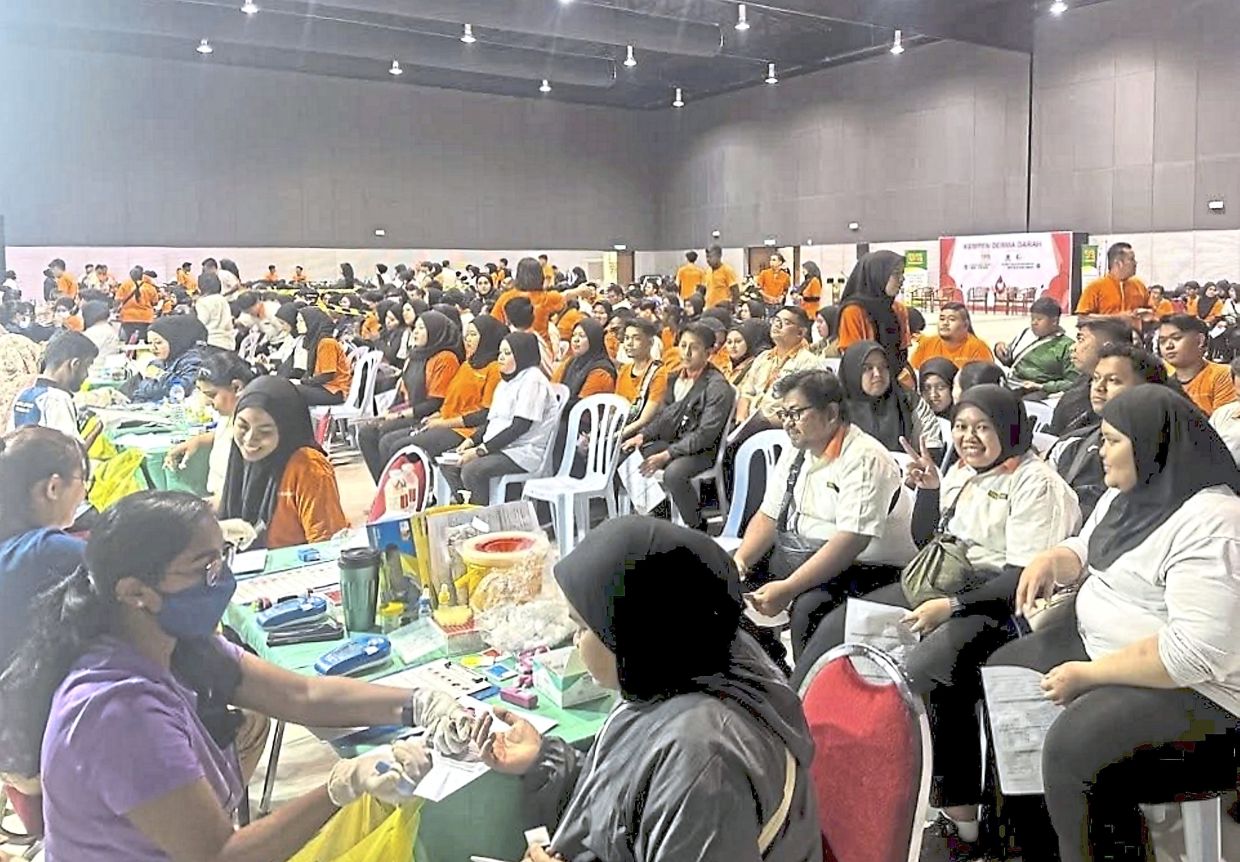 Donors waiting for their health screening before donating blood.