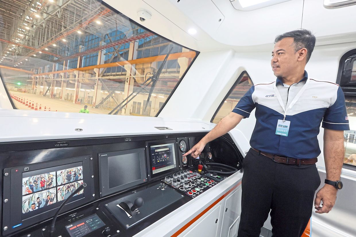RTSO rolling stock project manager Mohd Faiz Sudar explaining that the front cab is fully automated and driverless during regular operations.