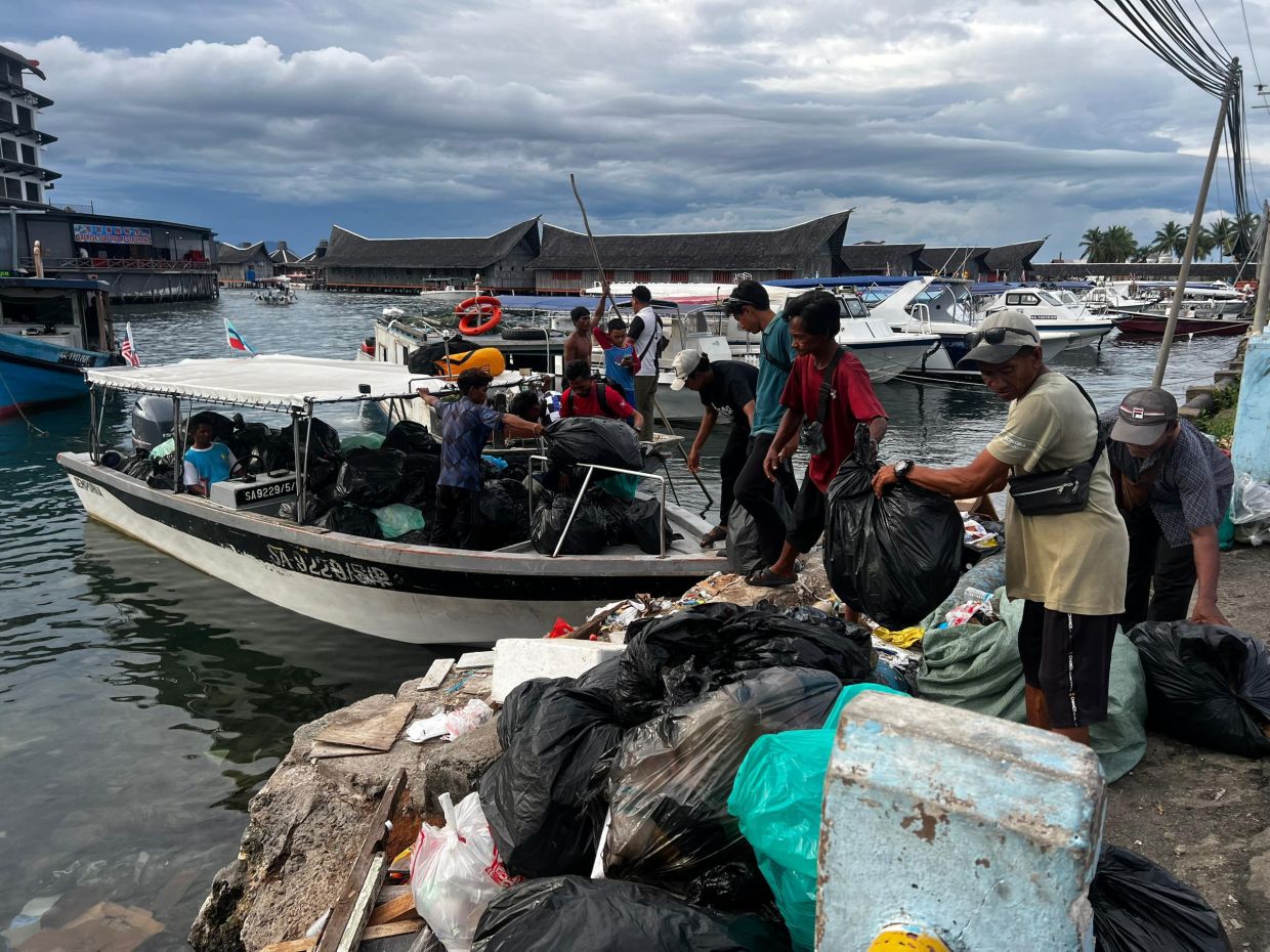 Collected waste arrives at the Semporna jetty for proper disposal.
