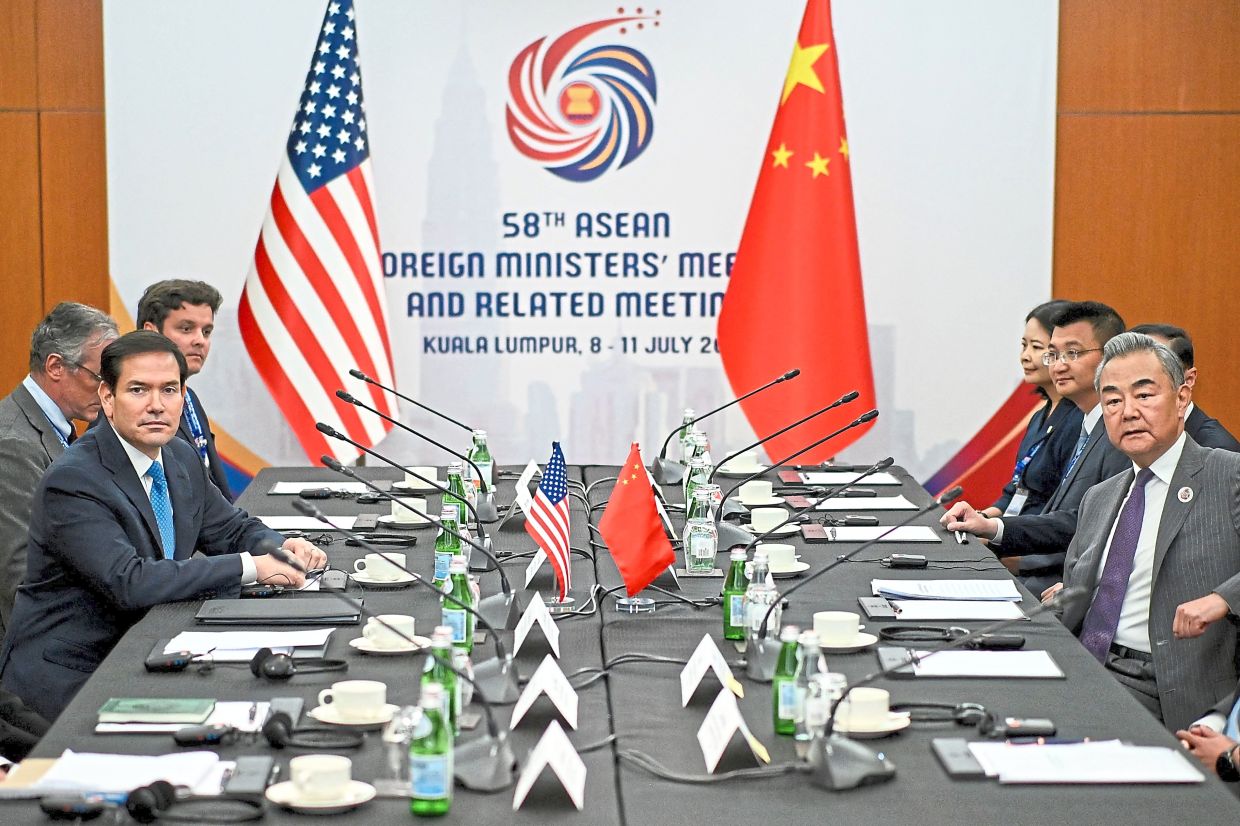 Great power dialogue: Rubio (left) meeting with Wang (right) at the sidelines of the Asean Foreign Ministers Meeting. — AFP