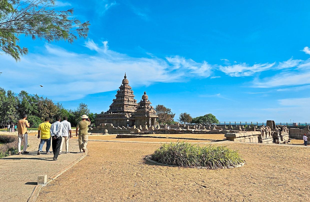 Visitors stroll through the Mahabalipuram Shore Temple courtyard in Mahabalipuram, Tamil Nadu. — TRISHA NG/The Star.