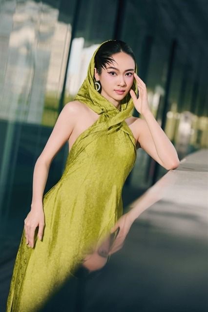 A model wears a fashionable dress created with silk made in Ma Chau. The pure silk, using natural dyes, is experiencing a revival with regular production by the villagers since 2015. - Photo courtesy of Ma Chau Silk