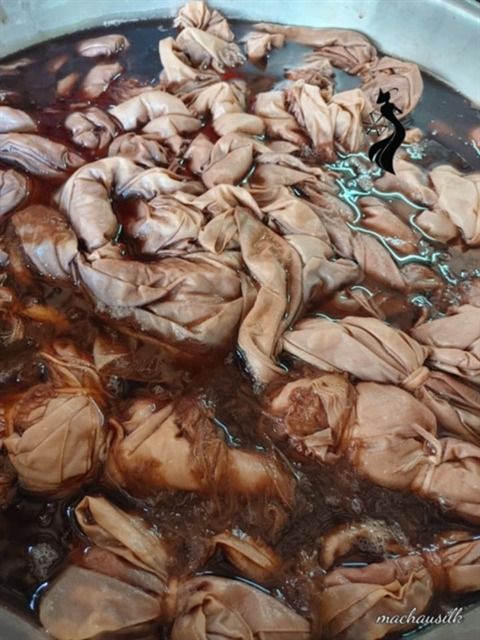 Silk is soaked in natural dyes at the Ma Chau silk workshop in Nam Phuoc Commune of Danang City. - Photo courtesy of Ma Chau Silk