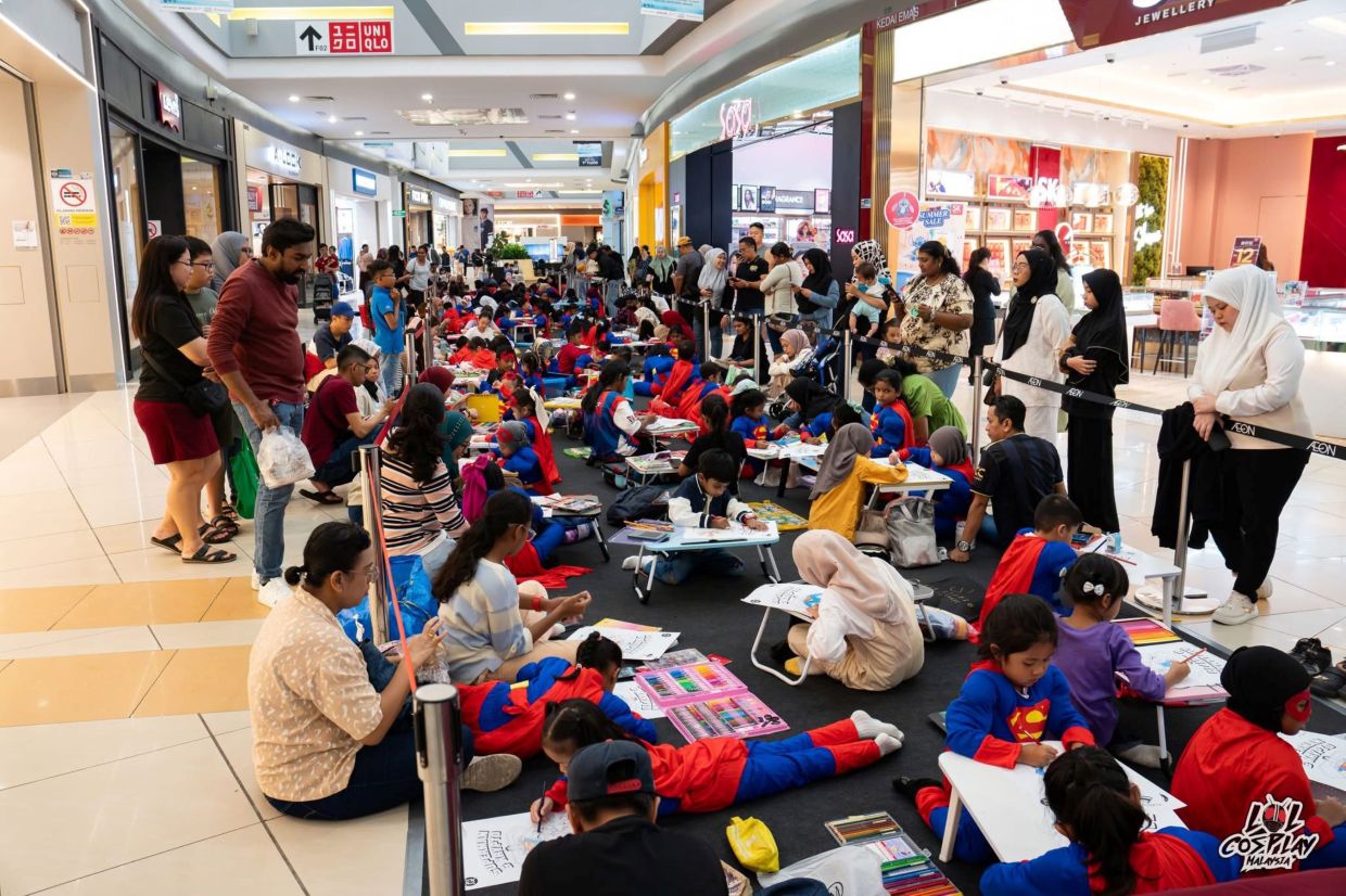 “Junior Superman” taking part in the colouring contest. - Photo credit: TGV Cinemas Facebook.