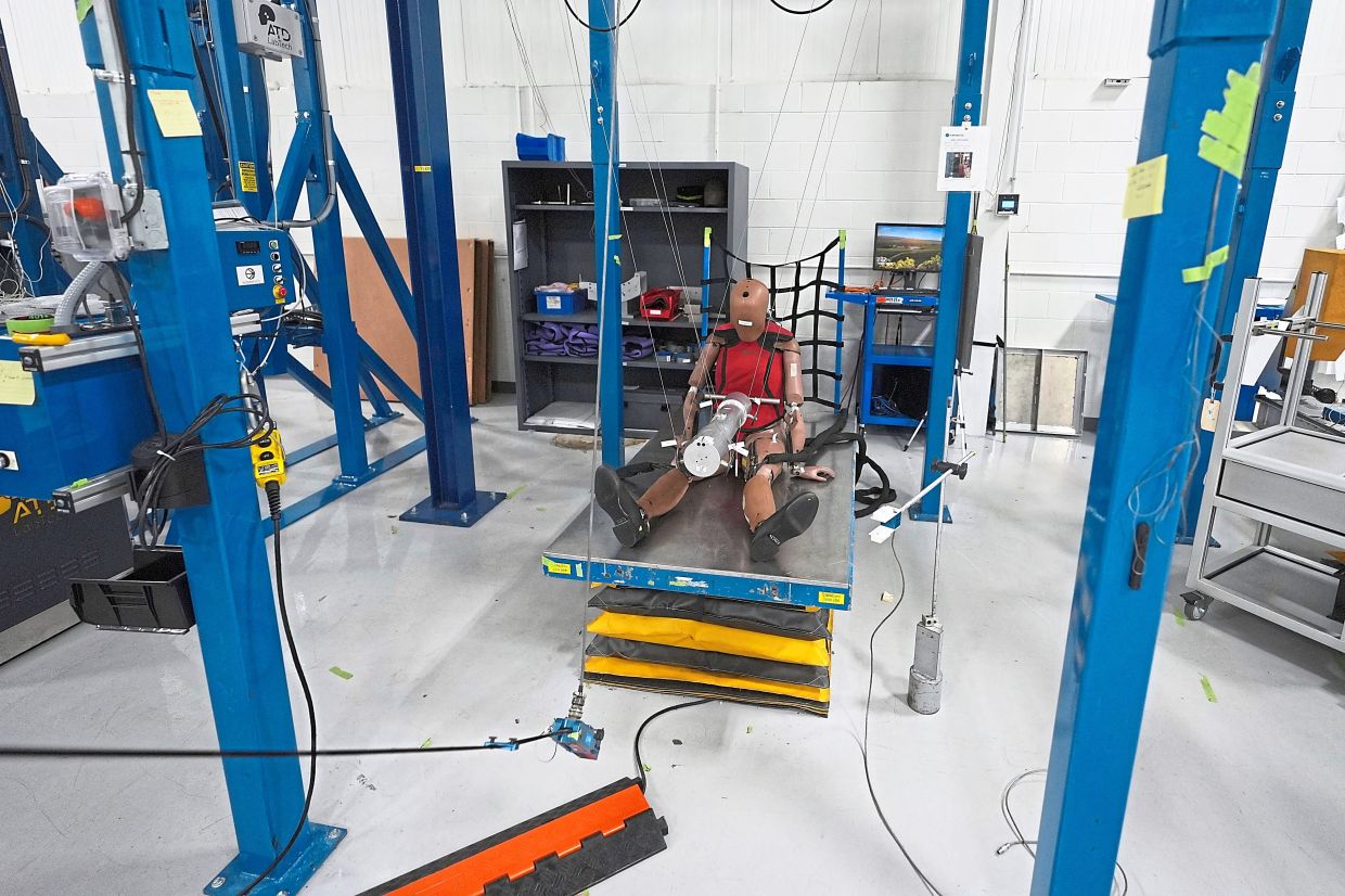 A THOR-5F female crash test dummy is shown on an impact rig. Photo: PAUL SANCYA/AP