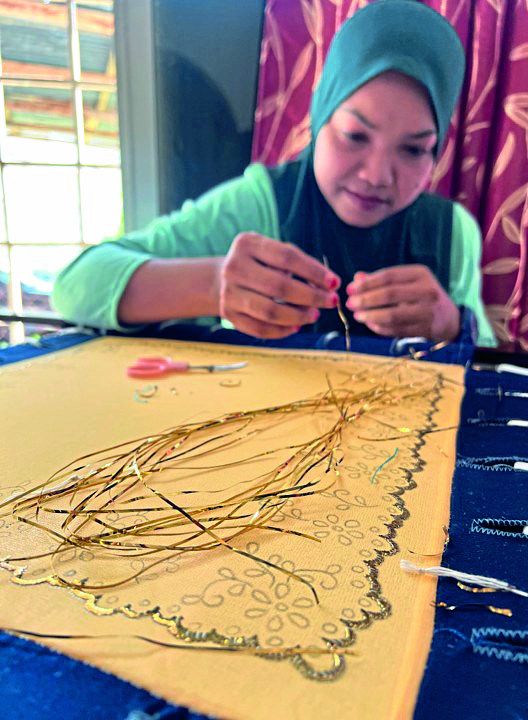 Crafting kelingkan, an intricate traditional embroidery unique to the east coast, demands deft skill and meticulous precision. — Photo: Yayasan Hasanah