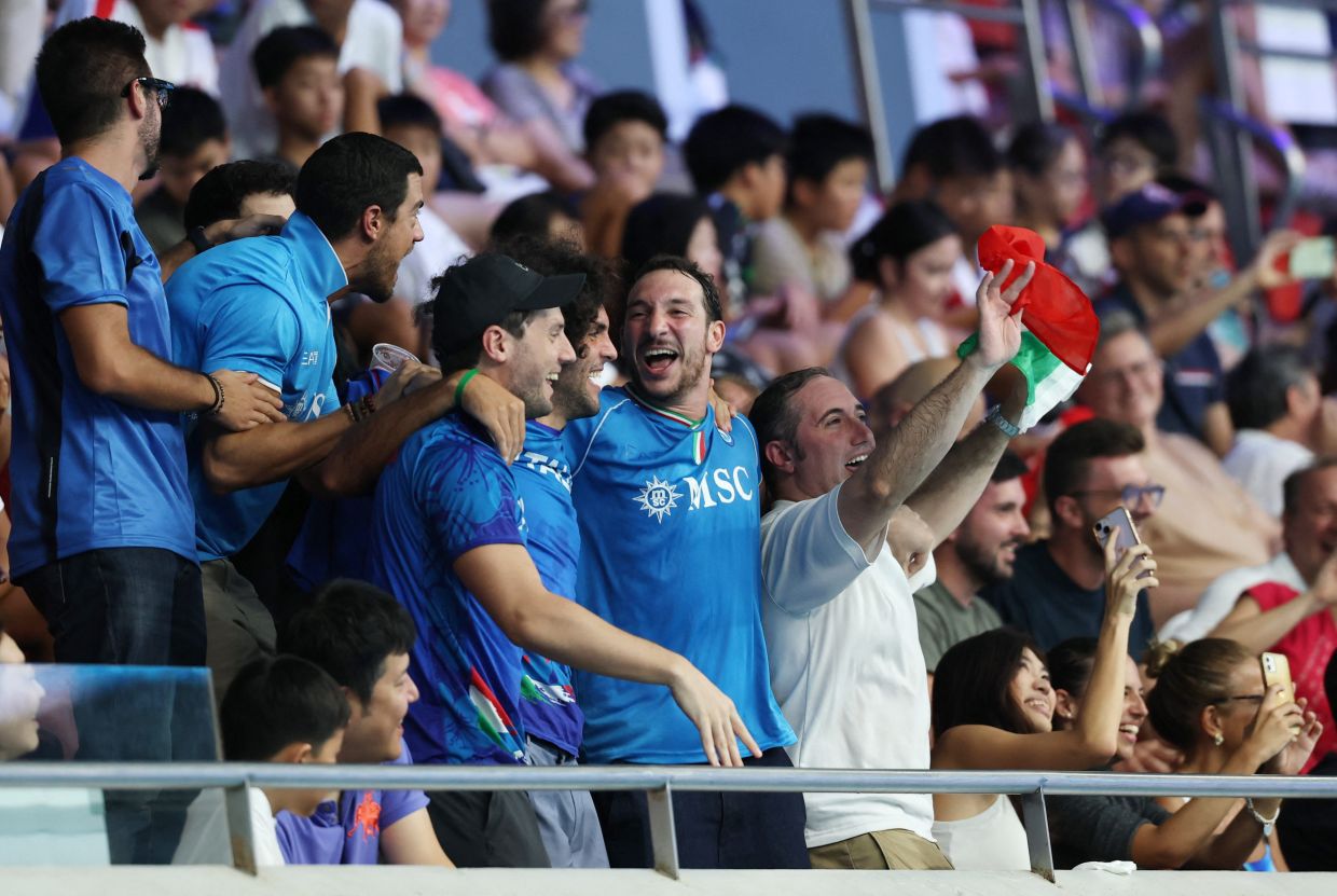 Water Polo - World Aquatics Championships - Men - Group A - Italy v Serbia - OCBC Aquatic Centre, Singapore - July 14, 2025Italy fans react in the stands. -- Photo: REUTERS/Jeremy Lee