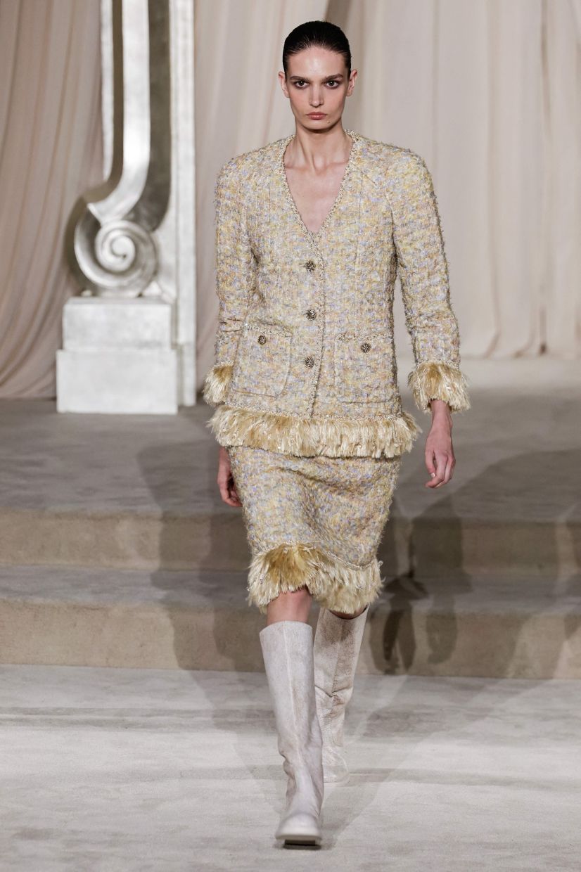 Boucle tweeds mimicked sheepskin with buttons beautifully handmade at Chanel. Photo: AFP