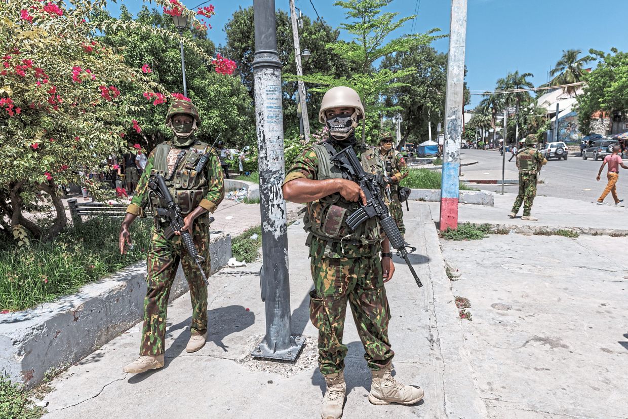 Kenyan police officers patrolling the Champ de Mars area in Port-au-Prince. — Adriana Zehbrauskas/The New York Times