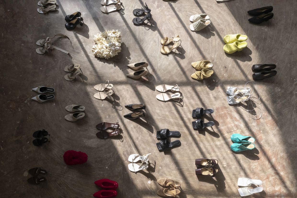 Dozens of Nina Christen’s shoe designs – Bottega Veneta, Loewe and Celine, among them – arranged in a grid in her home studio in Paris. Photo: The New York Times