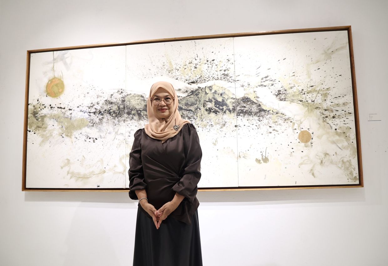 Lyne Ismail at her painterly debut exhibition 'Cat Town: Energy, Matter, And The Art Of Becoming' at Temu House, Petaling Jaya. Photo: The Star/Azman Ghani