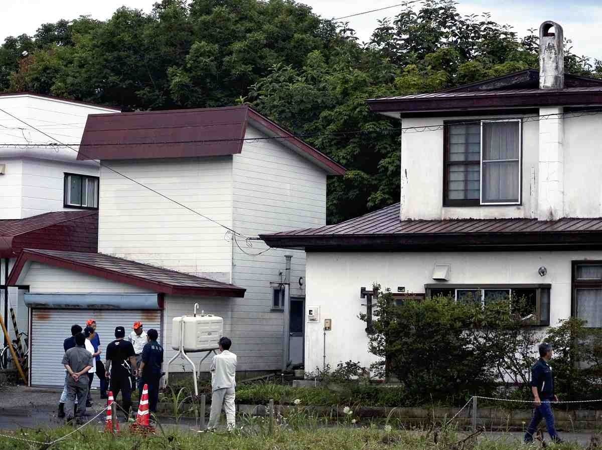 People are seen at the site where a brown bear was killed in Fukushima, Hokkaido, on Friday. - Photo: The Yomiuri Shimbun