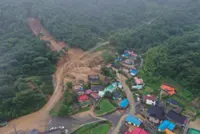 Death toll rises to 14 in South Korea as heavy rain triggers landslide and flooding