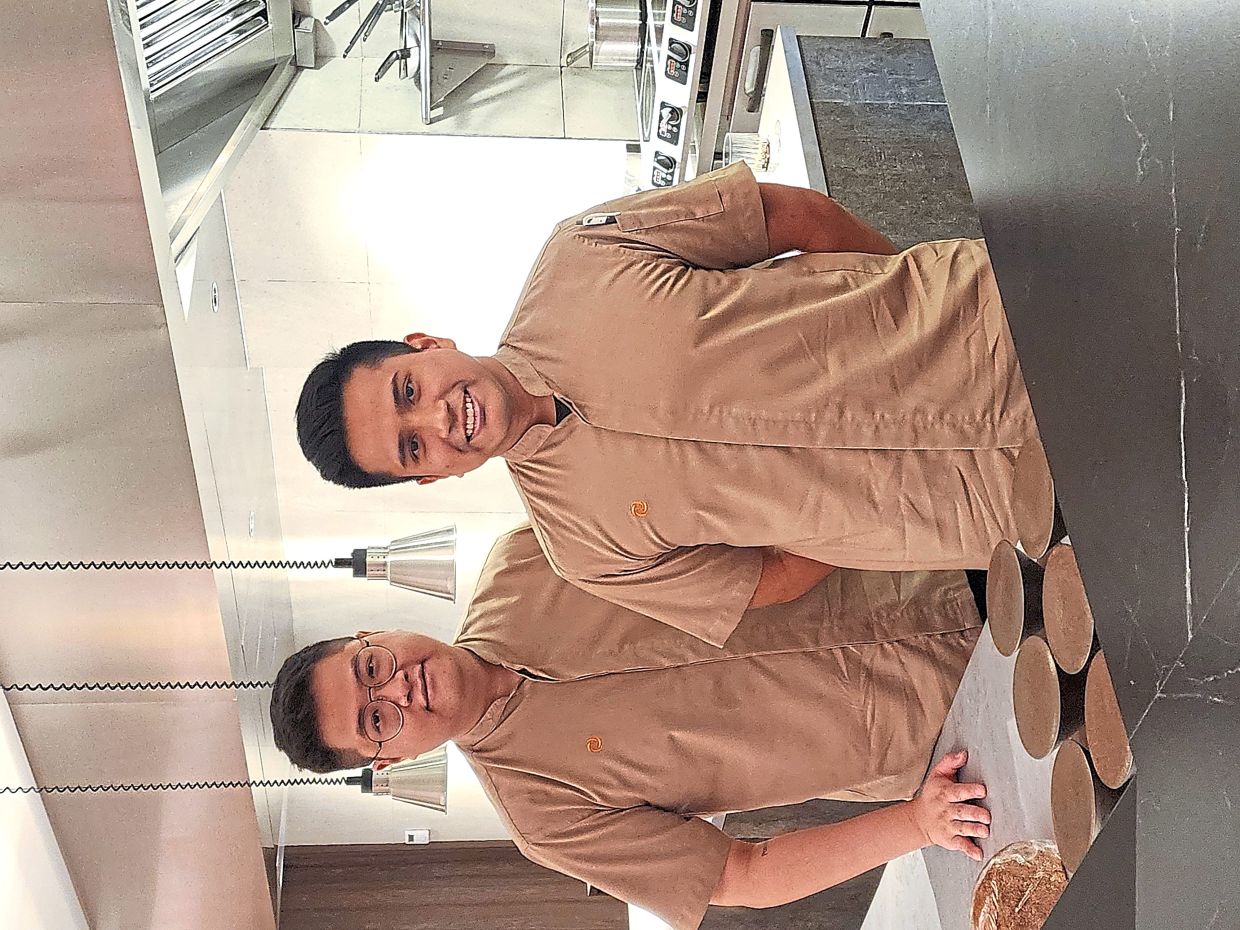 Chen (left) and John are the creative forces behind the restaurant’s East-West refined fare.