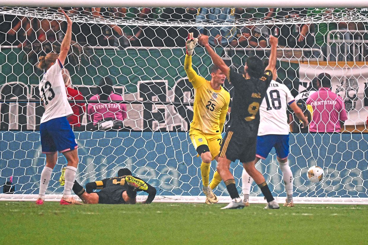 Mexico midfielder Edson Alvarez (on ground) scoring his team’s second goal in their 2-1 win over the US. — AFP Mexico fans outnumbered the Americans during the final at the NRG Stadium in Houston, Texas, on July 6. — AP