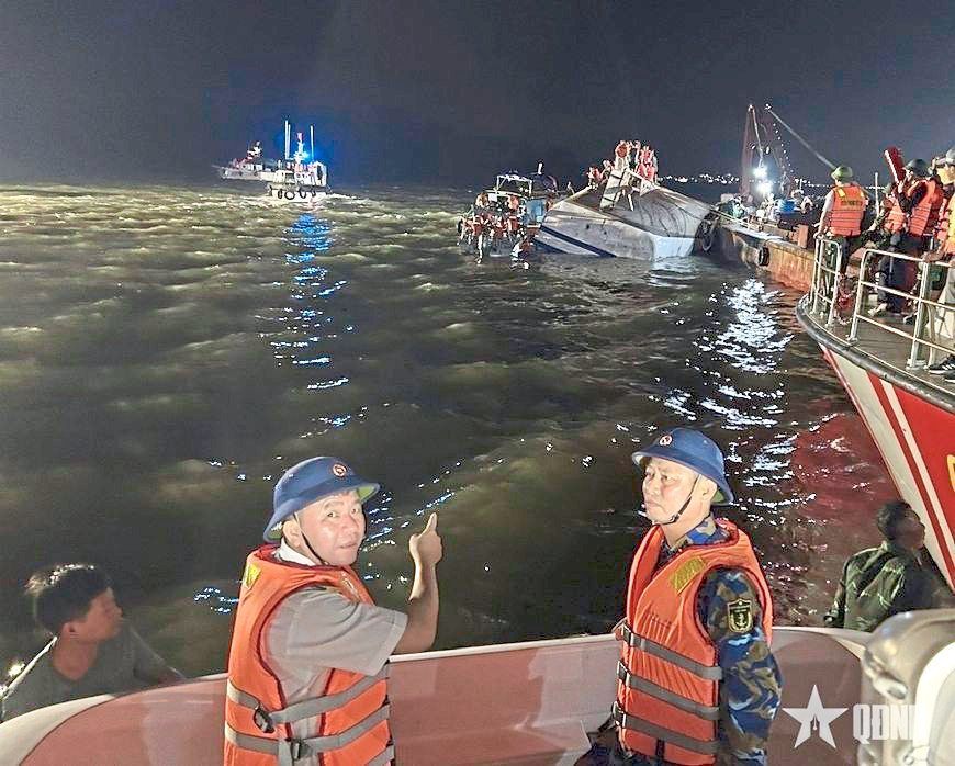 Tragic event: Rescue workers searching for victims after the boat capsized, in this screencap. — AP