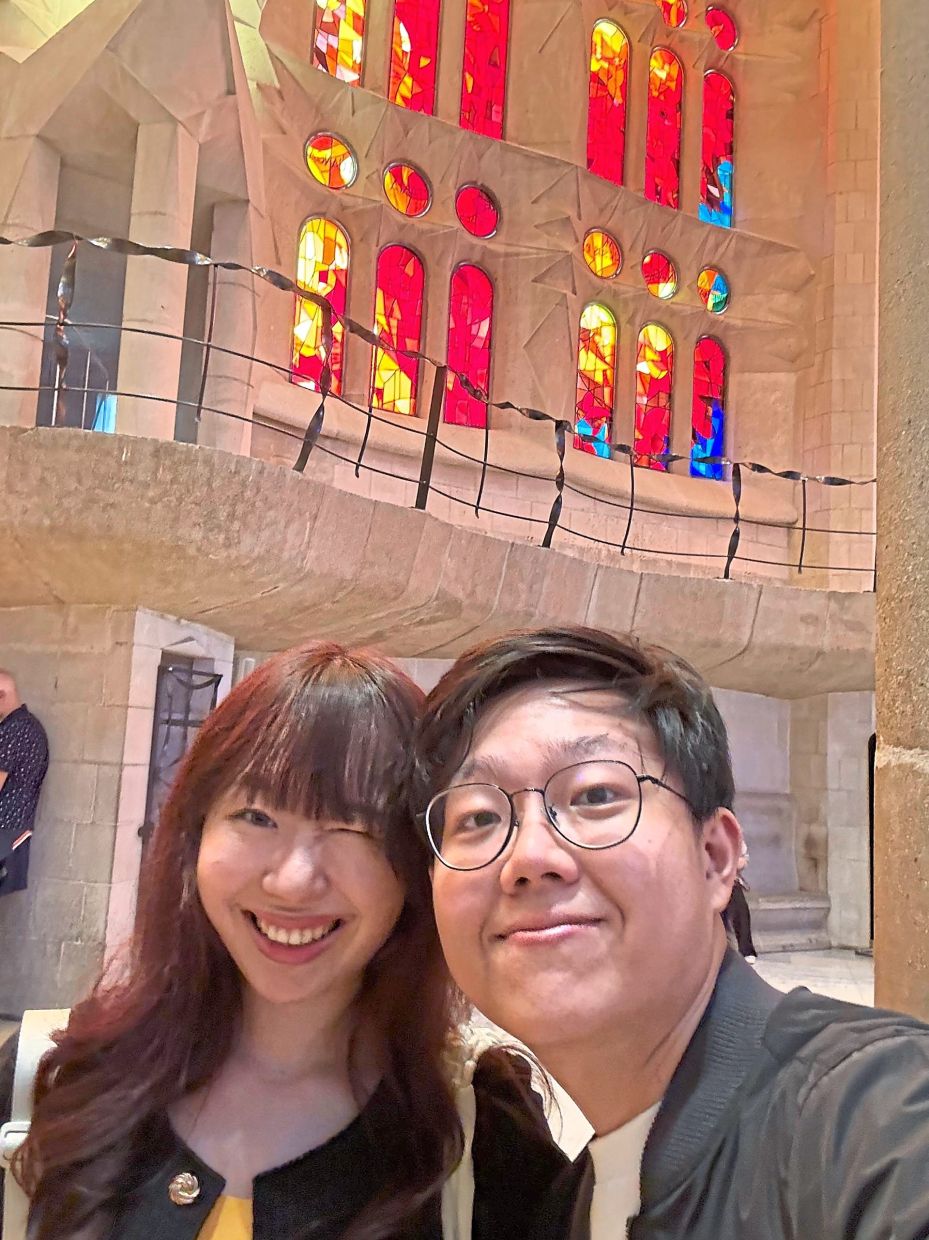Lim (left) and Go at the La Sagrada Familia in Spain. — VALERIE LIM