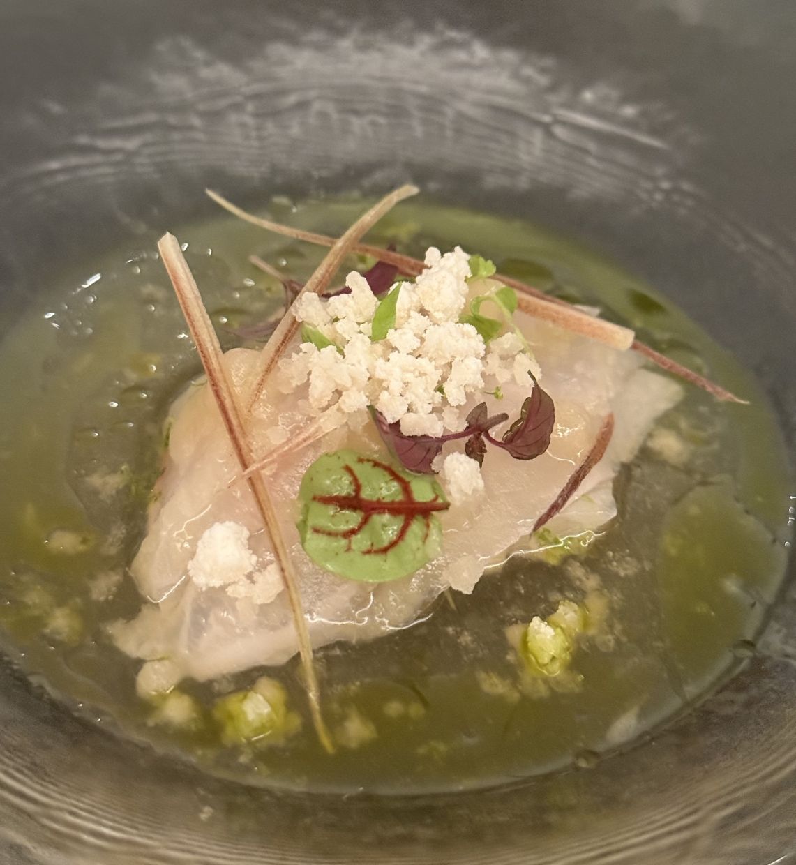 Silken, velvety slices of fish and tangy tomato water are the highlight of the striped jack.