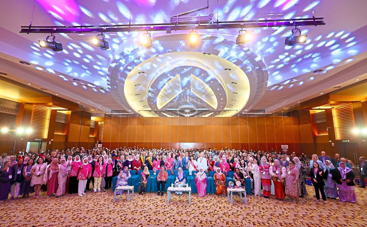 Dr Wan Azizah (seated centre) and guests with attendees of the Asean 2024 WEF at the Miti building in Kuala Lumpur.