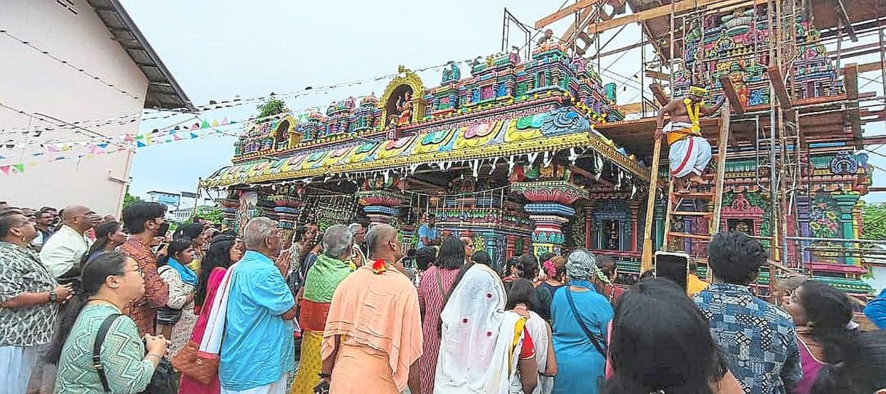 A large crowd of devotees at the consecration of the temple.