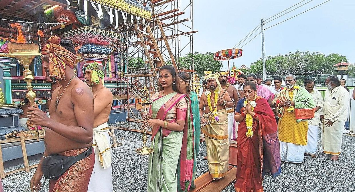 Manogaran (fifth from left) leading a mini-procession around the temple.