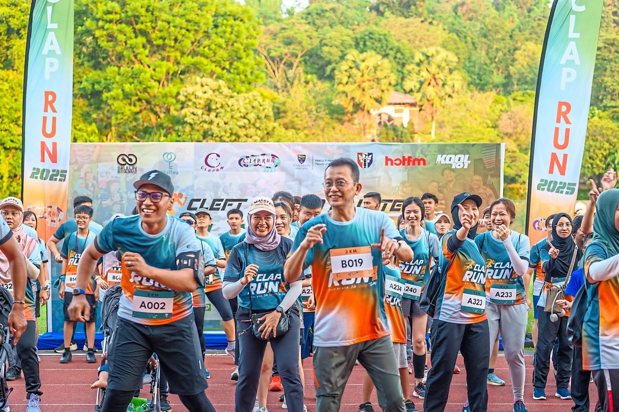 Prof Sabri (wearing bib B019) taking part in a Zumba session before the start of the run.