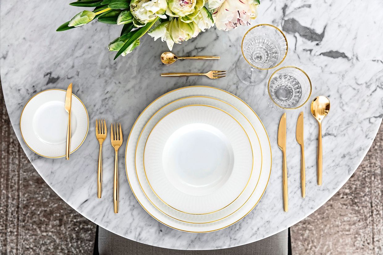 Villeroy & Boch's Chateau Septfontaines white tableware collection features lush golden rims and accents. — NIKOLAS HAGELE/Villeroy und Boch/dpa