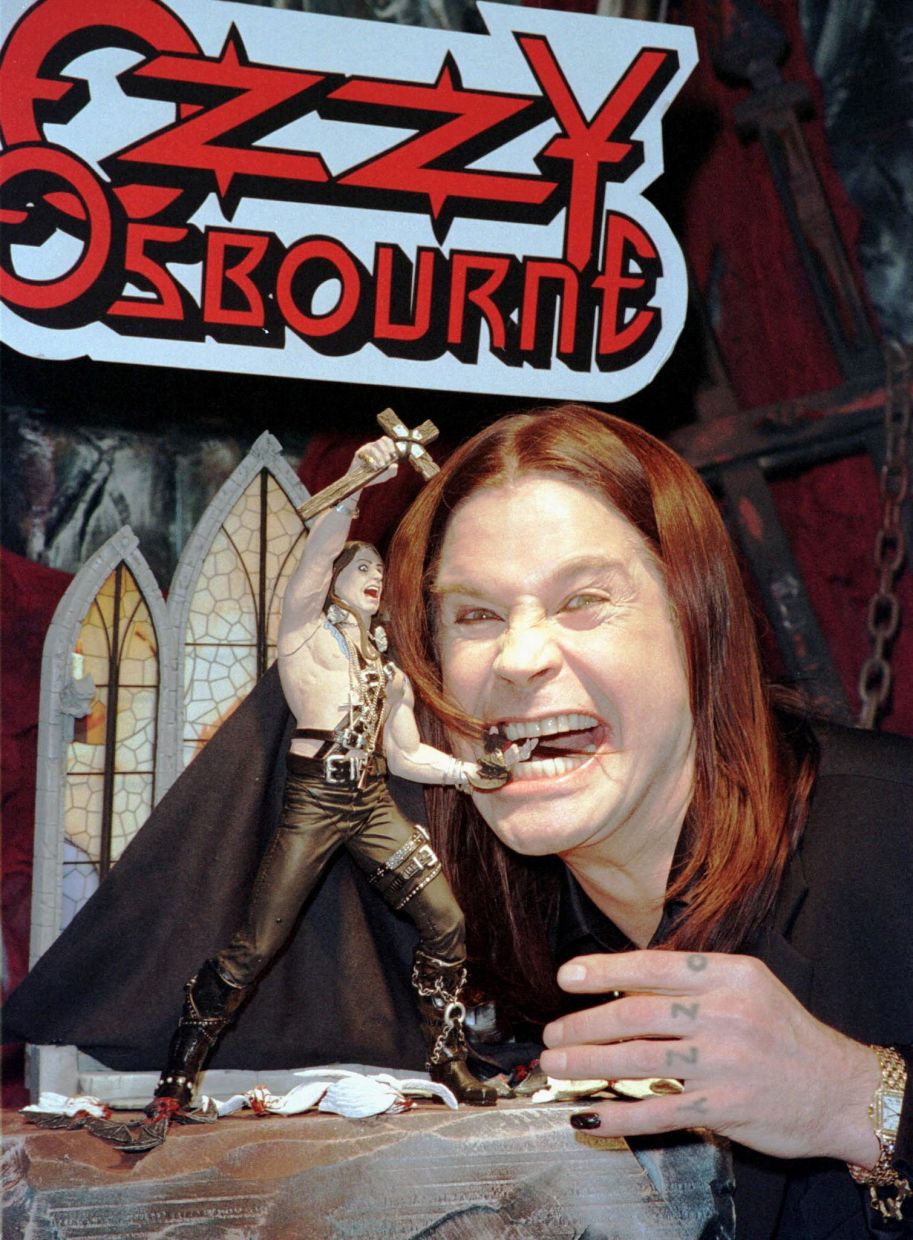 Rock Legend Ozzy Osbourne poses for photographers with his new Ozzy action figure at the Toy Fair in New York, February 8. The action figure is part of a marketing package that includes the doll, comic book, and a one-issue magazine. REUTERS/Brad Rickerby/File Photo