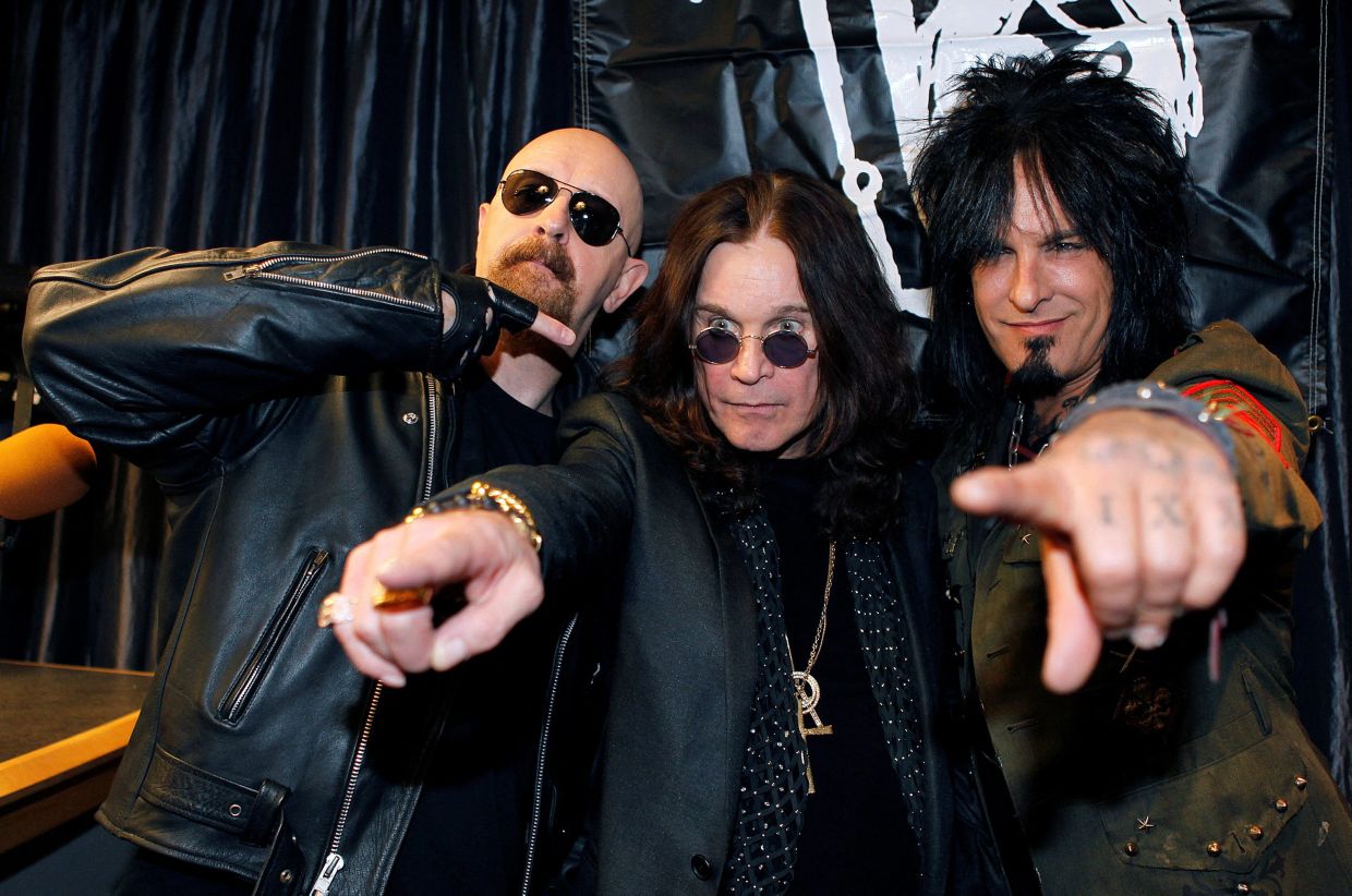 Rock musicians (L-R) Rob Halford, Ozzy Osbourne and Nikki Sixx pose during a news conference in Los Angeles April 30, 2010 announcing the lineup for their OZZFest concert tour which kicks off August 14, 2010 in San Bernardino, California. REUTERS/Fred Prouser/File Photo