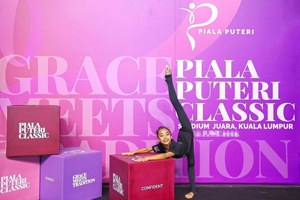 Saleha Mohd Faiq strikes a pose after completing her routine.