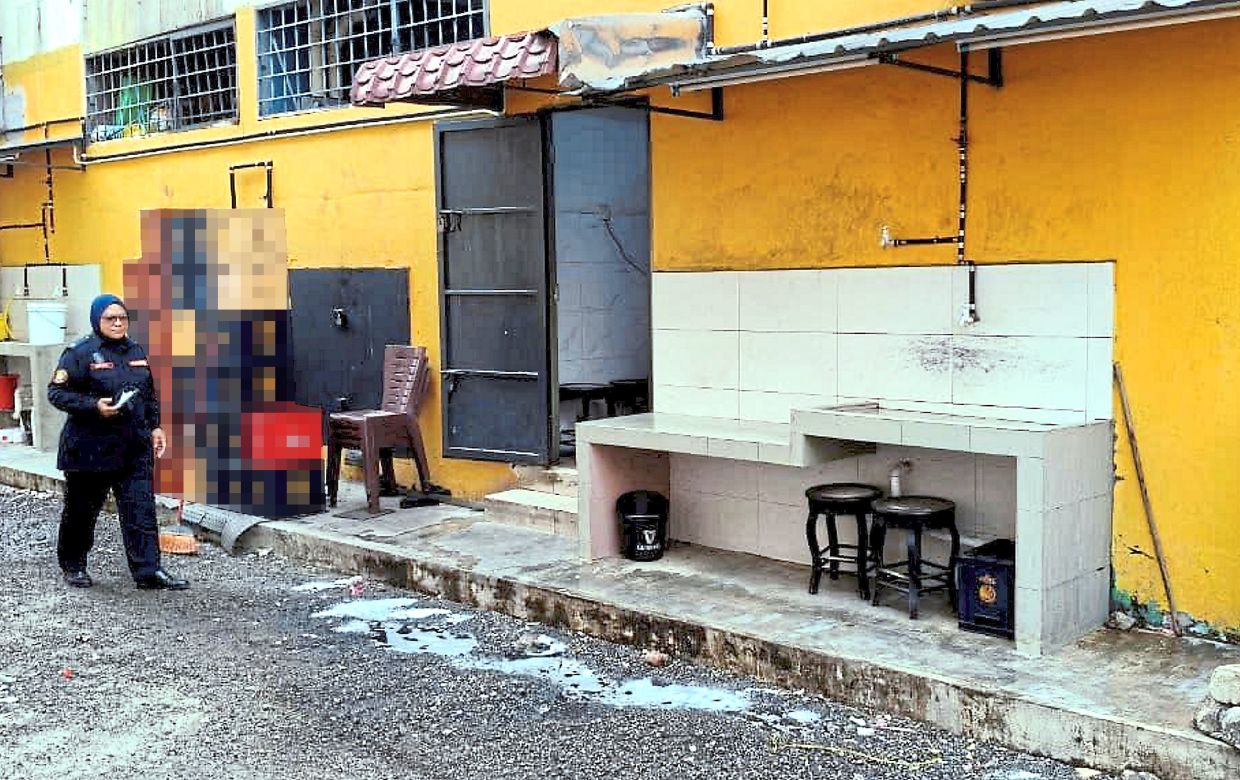 MBDK enforcement personnel checking the back lane where a restaurant has extended its kitchen.