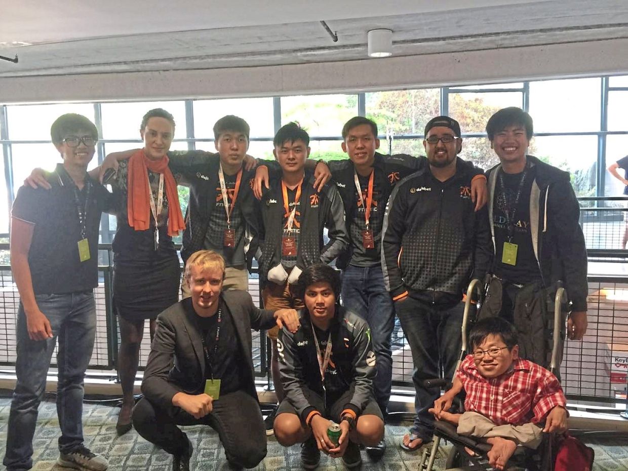 Tan surprised everyone by travelling alone to Seattle for The International, an annual Dota 2 competition. He is pictured here with the Malaysian Dota 2 team. Photo: Tan Thong Kai
