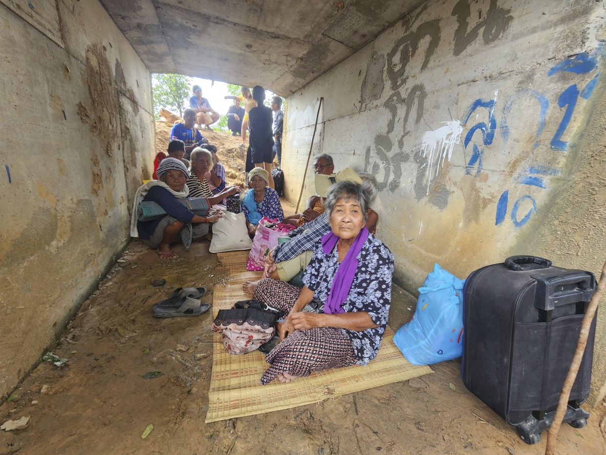 Thai people who fled clashes between Thai and Cambodian soldiers taking selter in Surin province on July 24, 2025. - AP