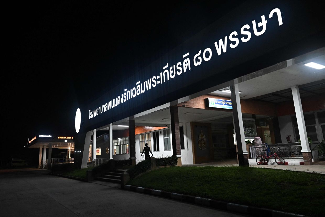 The exterior of Phanom Dong Rak Hospital, which sustained damage after being hit by Cambodian artillery, is pictured in the Thai border province of Surin on July 24, 2025. Thailand launched air strikes on Cambodian military targets on July 24 as Cambodia fired rockets and artillery, killing at least 11 civilians, in a dramatic escalation of a long-running border row between the two neighbours. -- Photo by Lillian SUWANRUMPHA / AFP